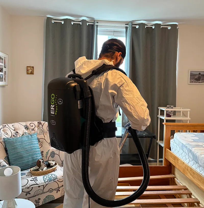 A professional pest control technician performing service